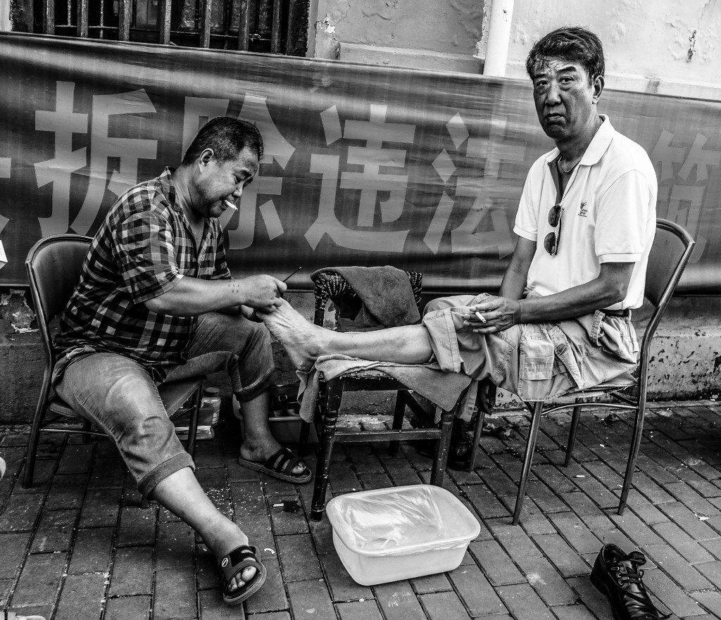路边修脚师傅
