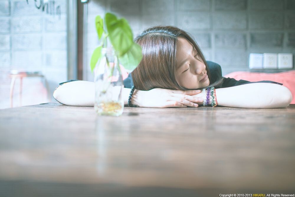 Portrait of young girl<br />
Portrait of young girl in cafe, Youth Hostel, Jiangyin <br />
Rd, Shanghai, China, May 1, 2013
