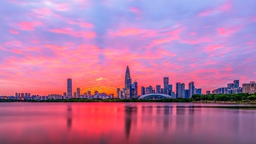 落日楼头映水滨