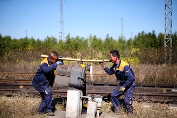47057