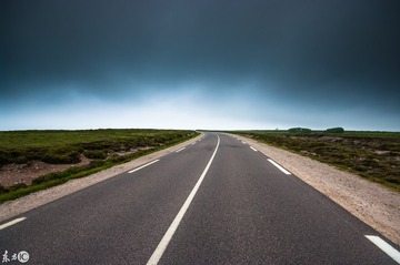 empty road with dark clouds