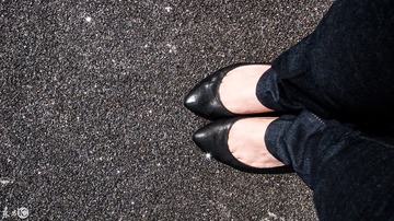 Girl feet on a concrete ground