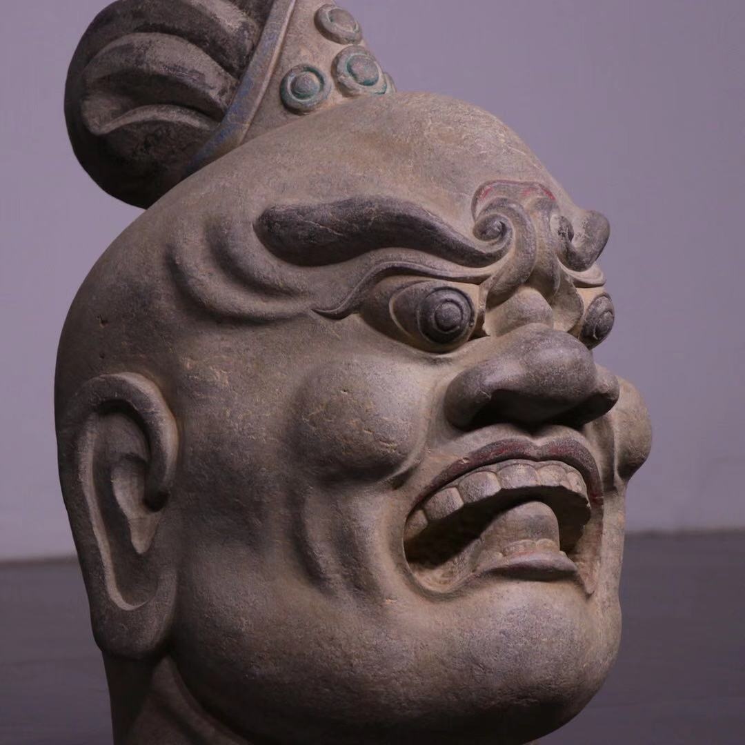 天王力士头表情威猛怒目而视面部肌肉隆凸有力嘴巴大张双眉紧锁双目