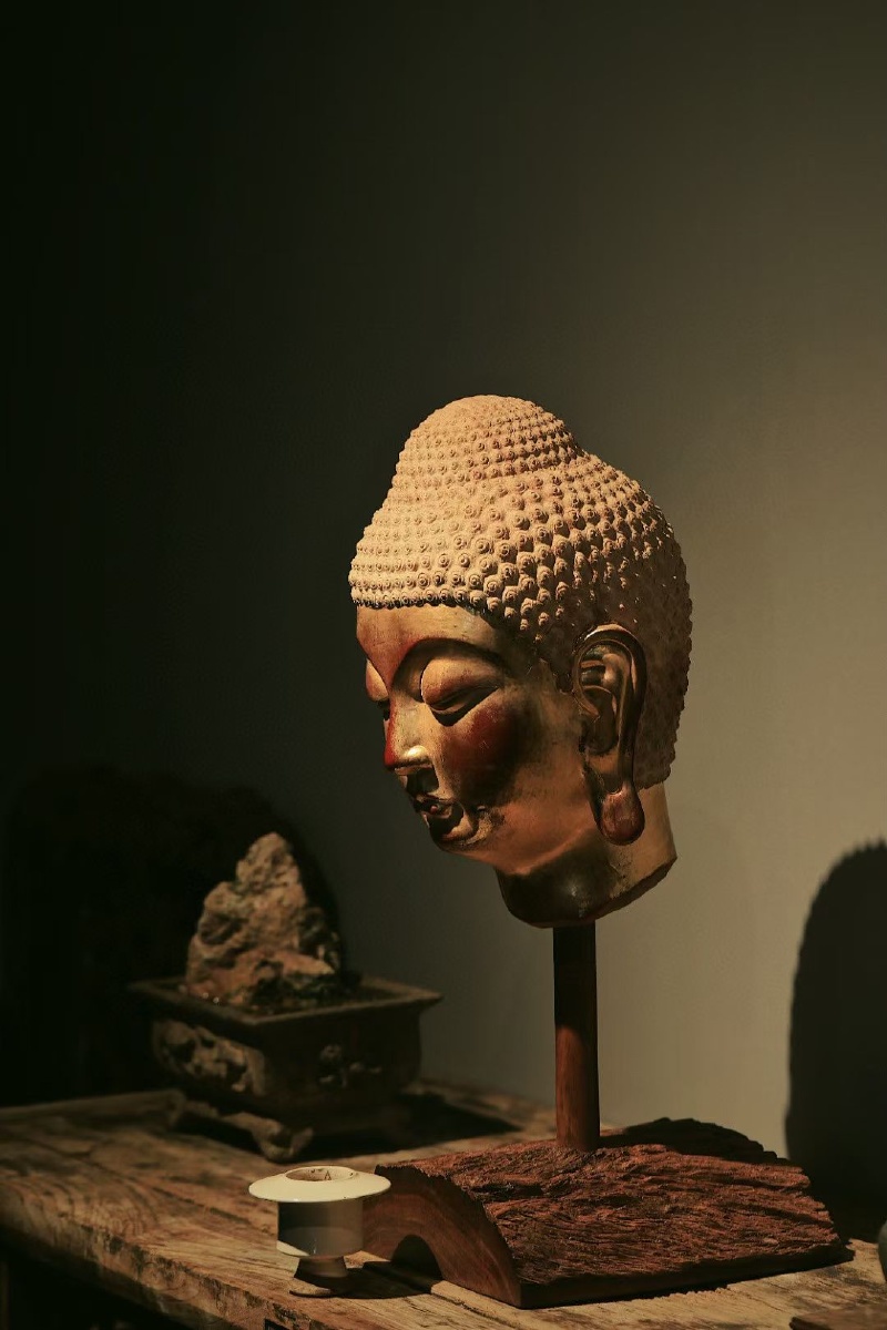 香樟木金箔佛首复刻龙门石窟佛首红漆作底又金箔髹面熠熠生辉殊胜非常