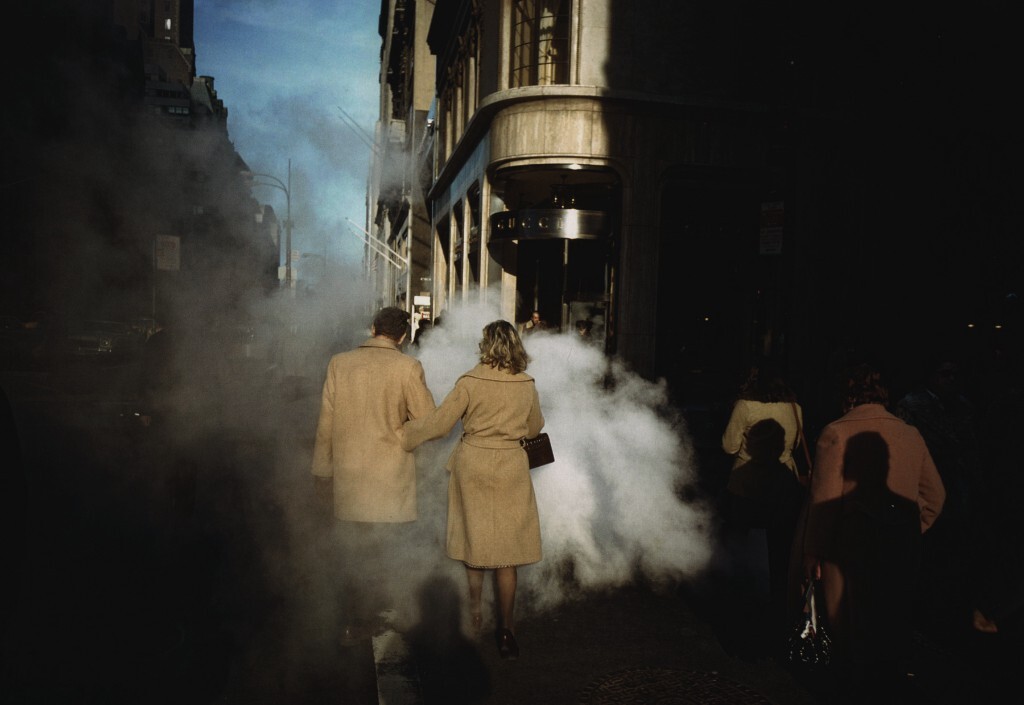Joel Meyerowitz: Camel Coat Couple in Street Steam, New York City, 1975.