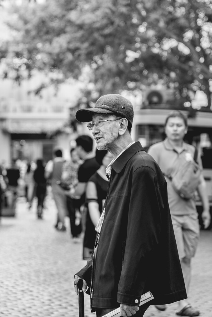 An old man in the Center Street of Harbin.