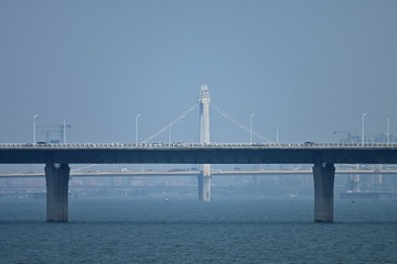 166087