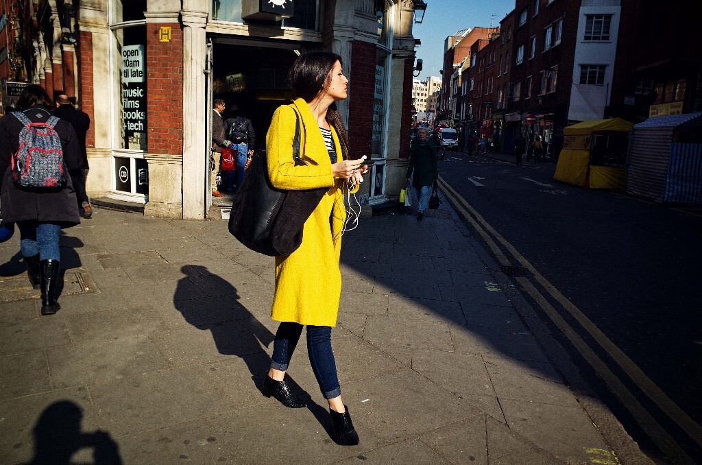 A girl with yellow coat