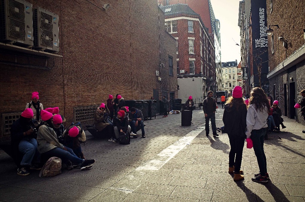 A group of pink woolen hats