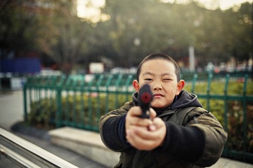 8-A boy with toy gun