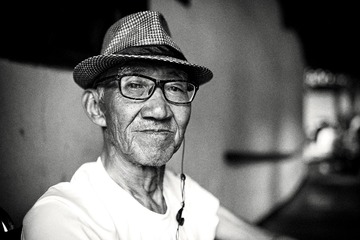 A portrait of an old man in the park