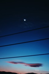 998577