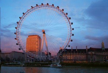 London Eye in front of the Shell Tower.JPG